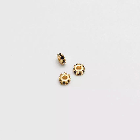 Herrajes Rondel circonias x 3 4 mm Negro en oro laminado 18k